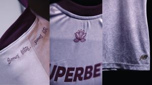 Detalhes do novo uniforme: peça lilás traz a frase "Somos Lótus, Somos Luta" bordada na gola e estampa inspirada na flor de lótus.